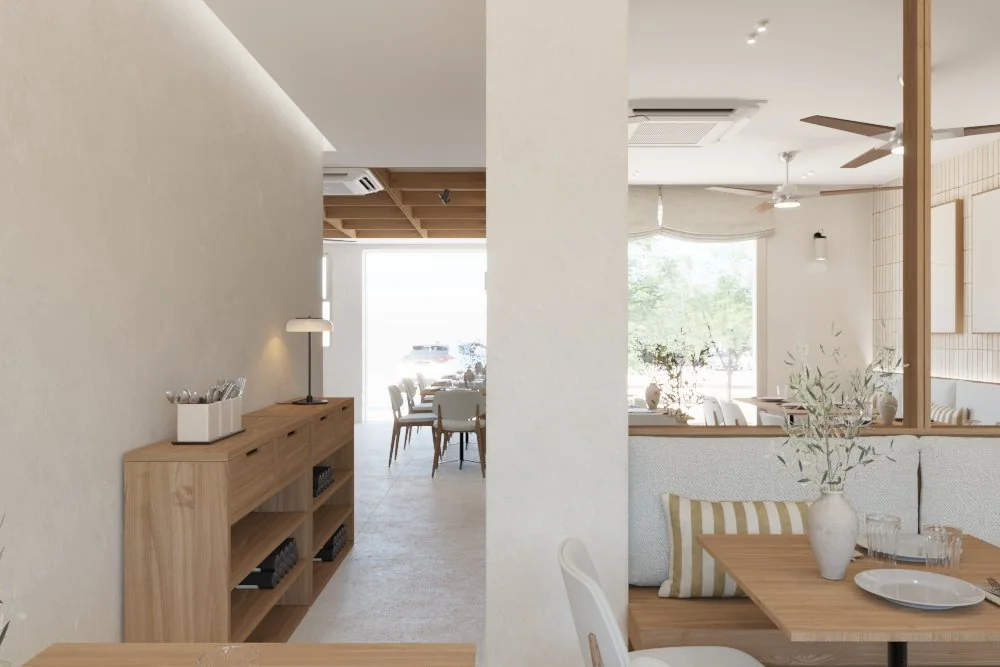 Paso al comedor con madera clara, espejo y vegetación discreta